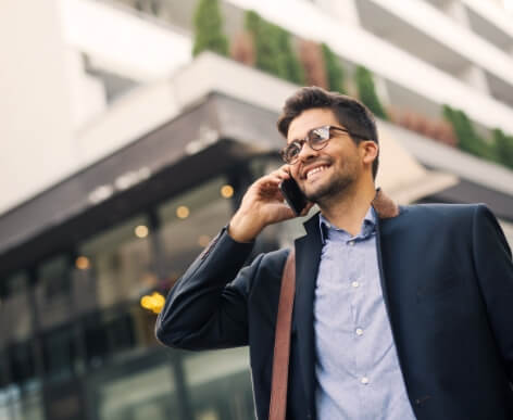 A man taking a call on the go