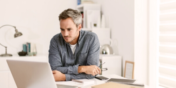 Man browsing a laptop